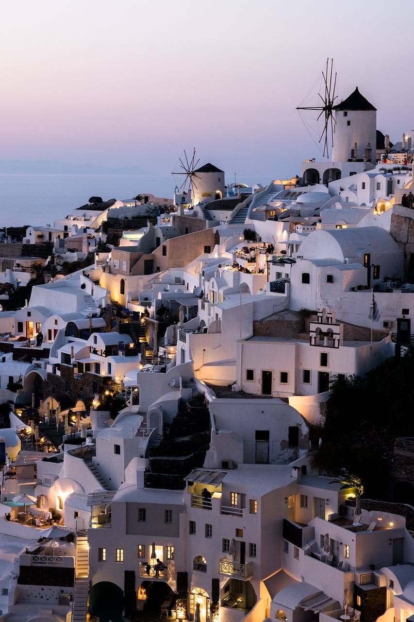 Whitewashed cliffside homes overlooking the sea in Santorini, Greece